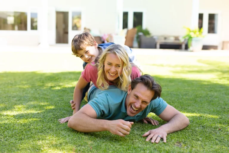 A family in their newly landscaped home